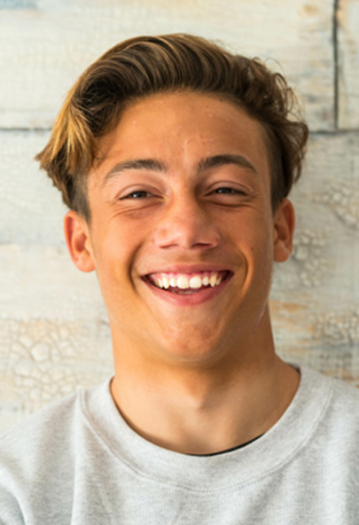 Male teenager smiling after receiving general anesthesia in Bakersfield