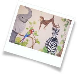 Wall art of an elephant, a zebra, a monkey, and a macaw