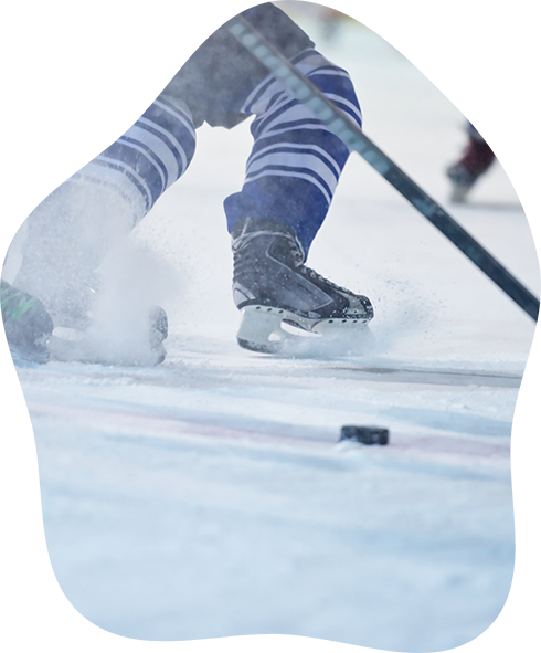 Close up of a person skating on a hockey rink