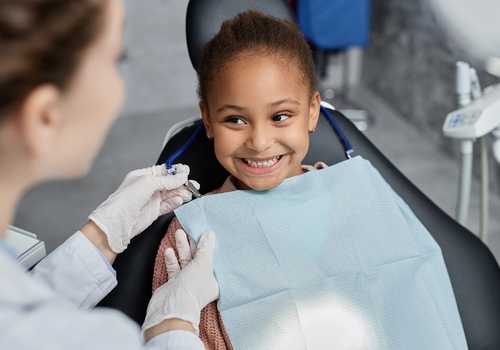 Girl smiling at the dentist