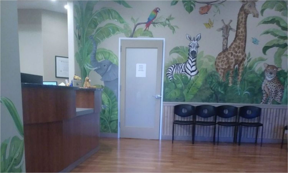 Mural of jungle animals on a wall of the reception area