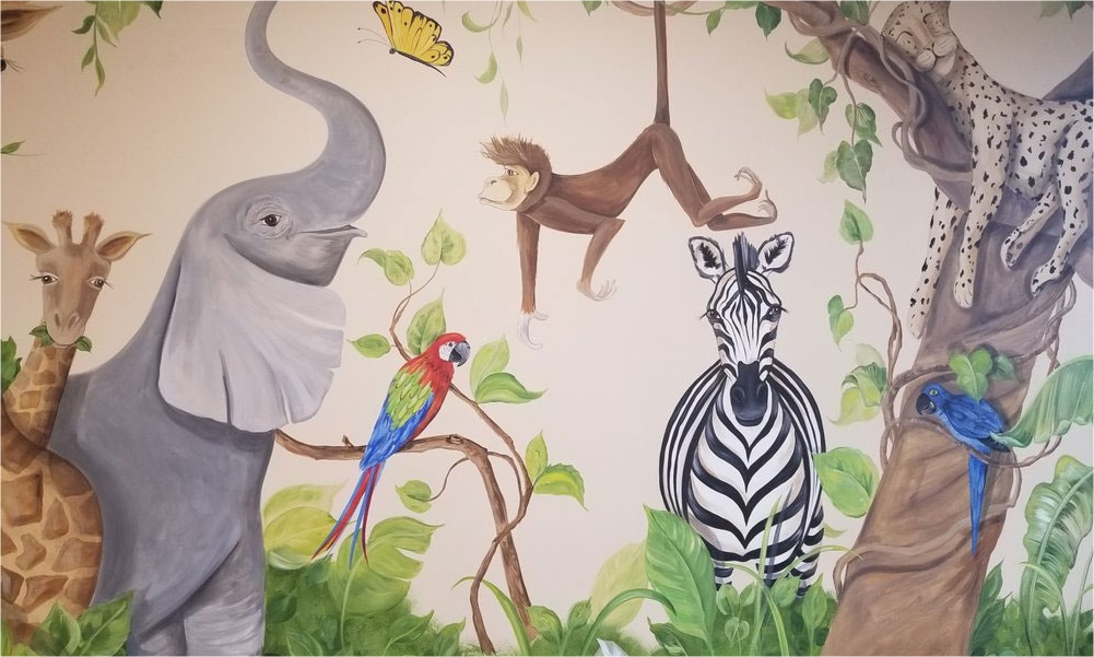 Close up of wall art featuring several jungle animals