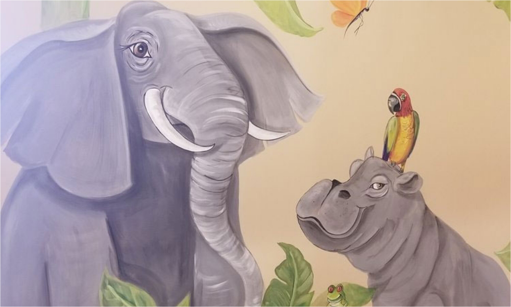 Wall art of an elephant and a hippo with a bird perched on its head