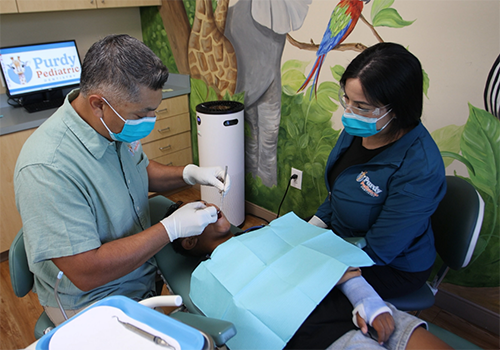 Young girl receiving a preventive dental checkup