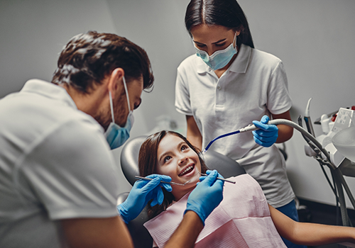 Young girl receiving a preventive dental checkup