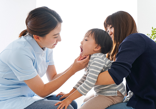 Dentist examining a baby's mouth
