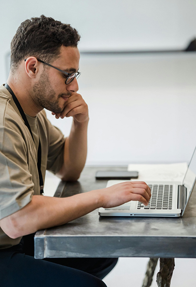 Man using his laptop to request a pediatric dental appointment in Bakersfield