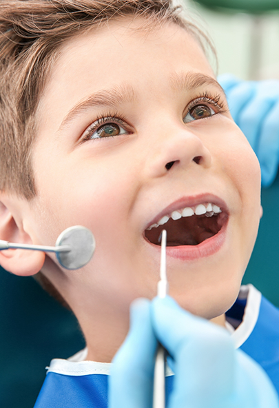 Young boy receiving a dental exam