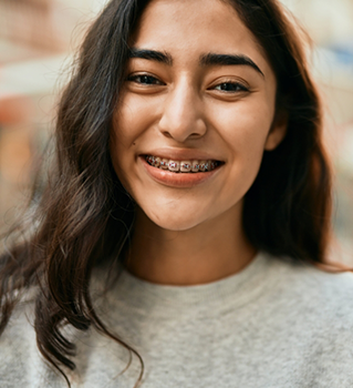 Smiling teenage girl with braces