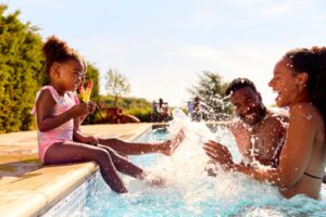 Family enjoying the summer at the pool