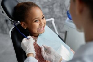 Young girl at the dentist smiling